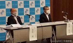 22年度事業計画を発表する半井代表理事（右）=四国ツーリズム創造機構提供=