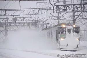 雪中を行く快速「エアポート」（JR北海道提供）